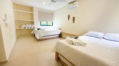 a bedroom with two beds in a room at Cabaña Tierramia 3 in San Silvestre