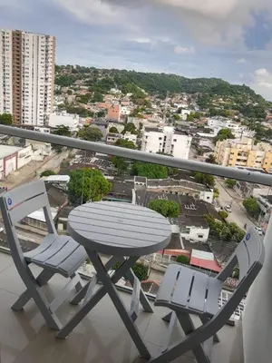 a table and two chairs on a balcony with a view at nice and affordable in Cartagena de Indias