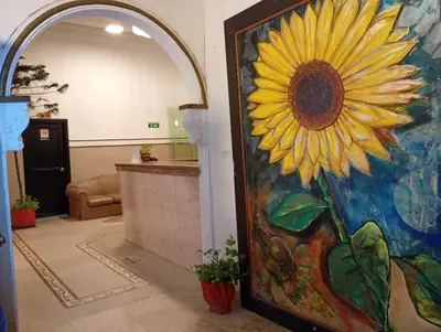 a door with a sunflower painted on it at Hotel Girasol Inn Barranquilla in Barranquilla