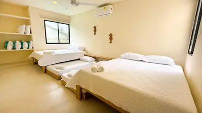a hospital room with two beds and a window at Cabaña Tierramia 2 in San Silvestre