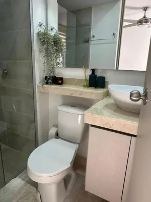 a bathroom with a white toilet and a sink at Apartamento Económico en Cartagena in Cartagena de Indias