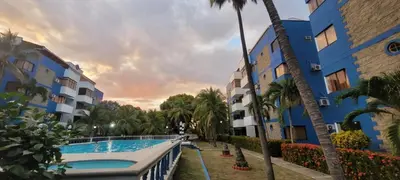 a swimming pool in front of a building at Vikingos de Tolú, a un Salto de las Islas in Tolú