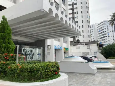 a building with a sign in front of a parking lot at Vive 801 in Cartagena de Indias