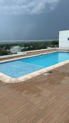 a large swimming pool on top of a building at Baluarte de caribe 212 in Cartagena de Indias