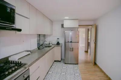 a kitchen with a stainless steel refrigerator in it at Dilla House in Cartagena de Indias