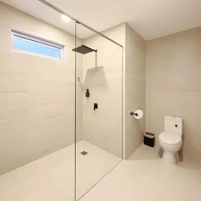 a bathroom with a toilet and a glass shower at Stanza Del Mar in Coveñas