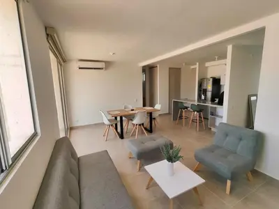 a living room with a couch and chairs and a table at Encantador Apartamento en Serena del Mar in Manzanillo del Mar