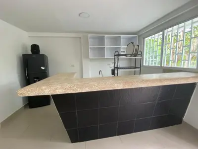 a kitchen with a large counter top in a room at Cómodo & Económico Apartamento en La Boquilla Zona Norte Cartagena in Cartagena de Indias