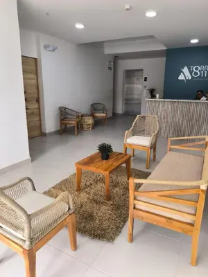 a group of chairs and tables in a room at APTO A 5 MIN CAMINANDO PLAYAS DE MARBELLA y A 20 MIN DE MURALLAS in Cartagena de Indias