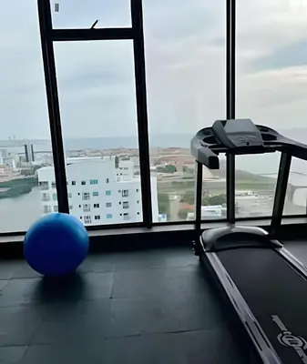 a room with a large window with a blue ball at Spectacular apartment, unparallel views! in Cartagena de Indias