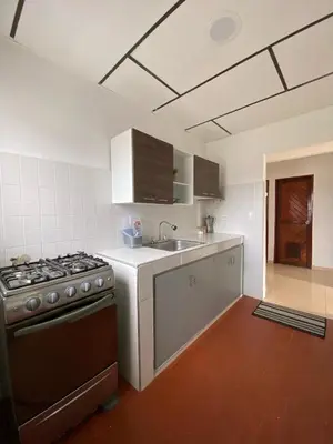 a kitchen with a stove and a sink at Acogedor apartamento excelente ubicación in Barranquilla