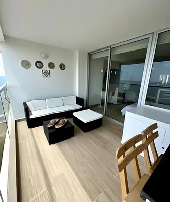 a living room with a couch and a table at Suite con Vista al Mar en Cartagena 1106CB in Cartagena de Indias
