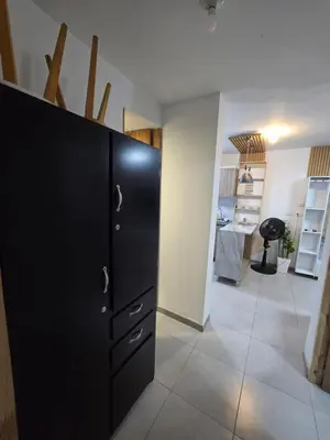a black cabinet in a room with a hallway at brisa y sol - sunset 47 in Cartagena de Indias