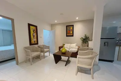 a living room with a table and chairs at New house in Barranquilla in Barranquilla