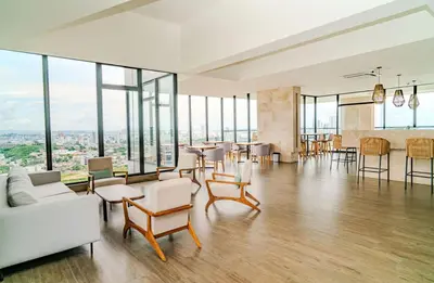 a living room with a lot of windows at Modern Sunset Stay Cartagena in Cartagena de Indias