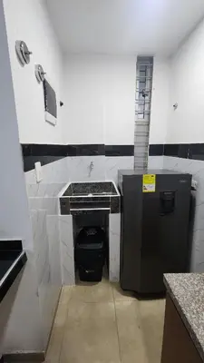 a bathroom with a sink and a trash can at Cabaña brisa de mar in San Silvestre