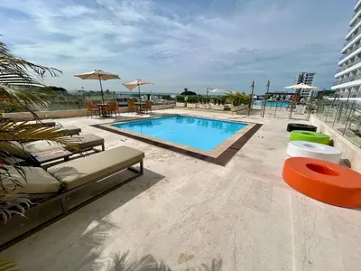 a swimming pool on top of a building at Suite Frente al Mar en Cartagena 1410 in Cartagena de Indias