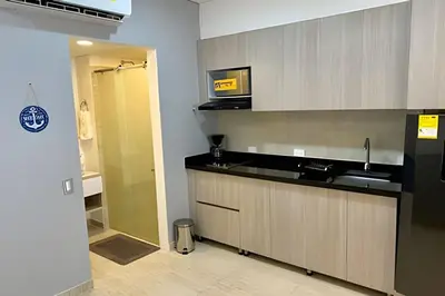 a kitchen with a counter and a sink and a shower at Suite con vista al mar Cartagena CB808 in Cartagena de Indias
