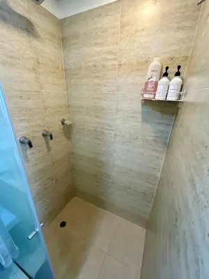 a bathroom with a shower with two bottles of soap at Suite con vista al mar Cartagena CB808 in Cartagena de Indias