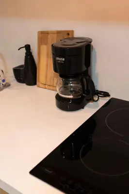 a coffee maker sitting on top of a counter at apartamento miniluxxury in Barranquilla