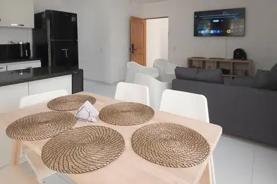 a dining table with straw hats on it in a living room at edificio Alba in Cartagena de Indias