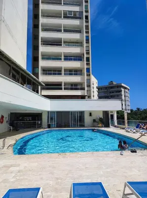 a large swimming pool in front of a building at Cartagena Beach con vista al mar in Cartagena de Indias