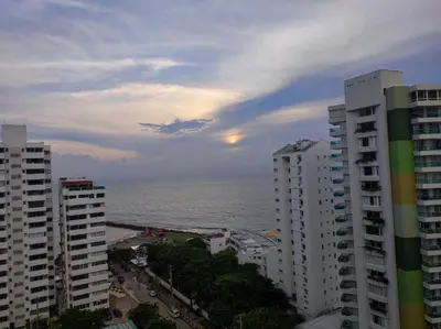 a view of the ocean between two tall buildings at Cartagena Beach con vista al mar in Cartagena de Indias