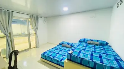 a bedroom with a blue bed in a room at Mayo Habitación Tolu in Tolú