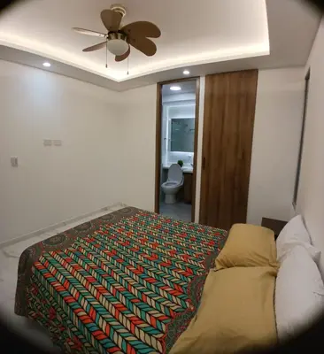 a bedroom with a bed and a ceiling fan at lindo departamento in Cartagena de Indias