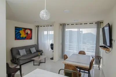a living room with a couch and a table at 2 double beds 2001 in Cartagena de Indias