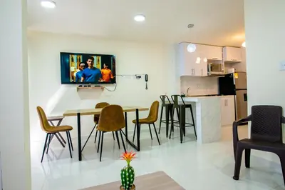 a dining room and kitchen with a table and chairs at 2 double beds 2001 in Cartagena de Indias