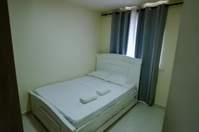 a small bed in a room with a window at 2 double beds 2001 in Cartagena de Indias
