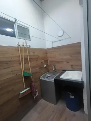 a bathroom with a sink and a counter and a sink at Rincón Barranquilla CERCA DE TODO in Barranquilla
