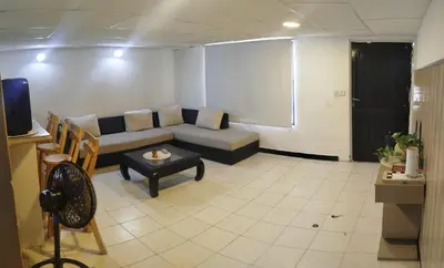 a living room with a couch and a table at casa perla del mar in Cartagena de Indias