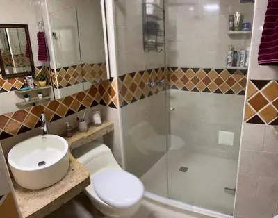 a bathroom with a toilet and a sink and a shower at Apartamento Vacacional en Bocagrande in Cartagena de Indias