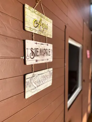 a group of signs on the side of a building at Brisas del Mar Barú in Playa Blanca