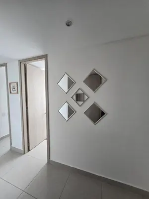 a wall with four shelves on a white wall at Espectacular Apartamento 9no piso in Cartagena de Indias