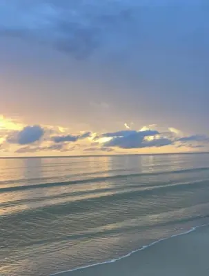 a view of the beach at sunset at Villa Ana tu hogar lejos de casa in Coveñas