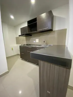 a kitchen with a sink and a stove in it at Apartamento para Grupos En La Boquilla BBB in Cartagena de Indias