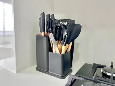 a black container filled with utensils on a table at Relax with a views, massage chairs and coffee station in Barranquilla