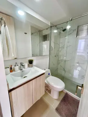 a bathroom with a sink and a toilet and a shower at Relax with a views, massage chairs and coffee station in Barranquilla