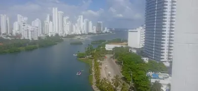 a river in the middle of a city with tall buildings at Apto luxury en el laguito edificio marina del rey cartagena frente al mar in Cartagena de Indias