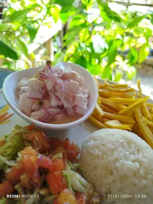 a plate of food with a bowl of meat and french fries at CARDUMEN Arte y Cocina in Playa Blanca