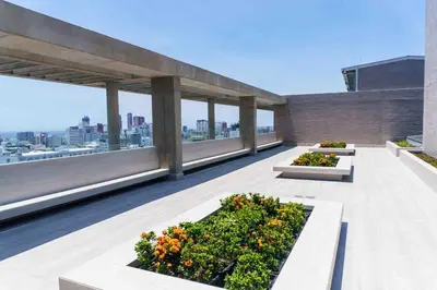 a balcony with several plants on a building at Suite 1010 - Ocean View - Distrito90 in Barranquilla