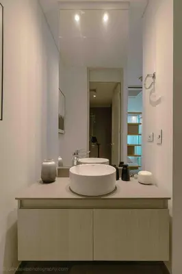 a bathroom with a sink and a large mirror at Suite 1010 - Ocean View - Distrito90 in Barranquilla