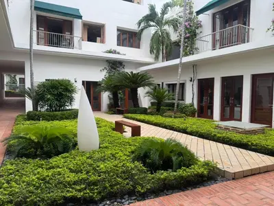 a building with a surfboard in front of it at Incredible 2BR with AC in Ciudad Amurallada in Cartagena de Indias