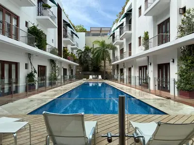 a swimming pool in the middle of a building at Incredible 2BR with AC in Ciudad Amurallada in Cartagena de Indias
