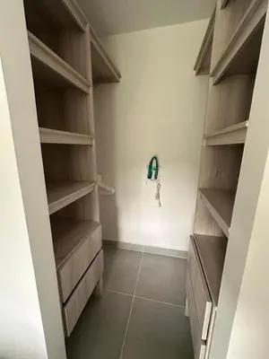 a walk in closet with wooden shelves at Cartagena Vibes-Apartamento Serena del Mar in Cartagena de Indias