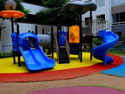 a playground with a blue slide on a colorful carpet at Hermoso apartamento en Miramar in Barranquilla