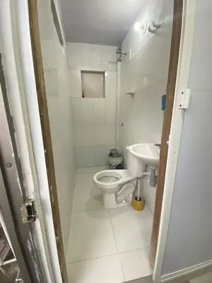 a small bathroom with a toilet and a sink at Apartaestudio Sara en Coveñas in Coveñitas